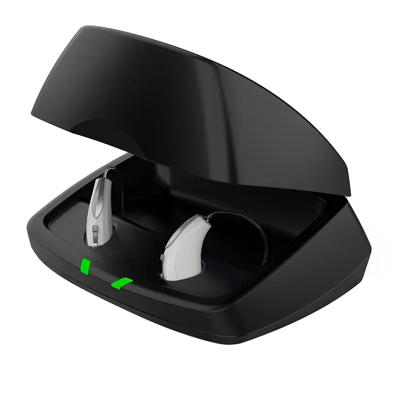 Chargeur noir Starkey avec deux embouts intra-auriculaires dans la base ouverte