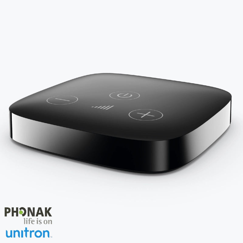 Boîtier noir du Phonak TV Connector 2 avec boutons tactiles en façade