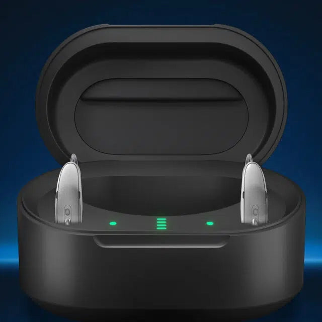 Chargeur Starkey noir ouvert, deux aides auditives visibles et voyants verts allumés.