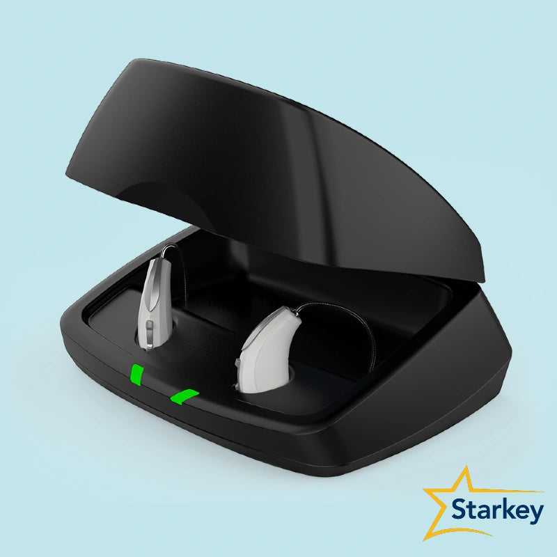 Chargeur Starkey noir ouvert avec deux aides auditives en place